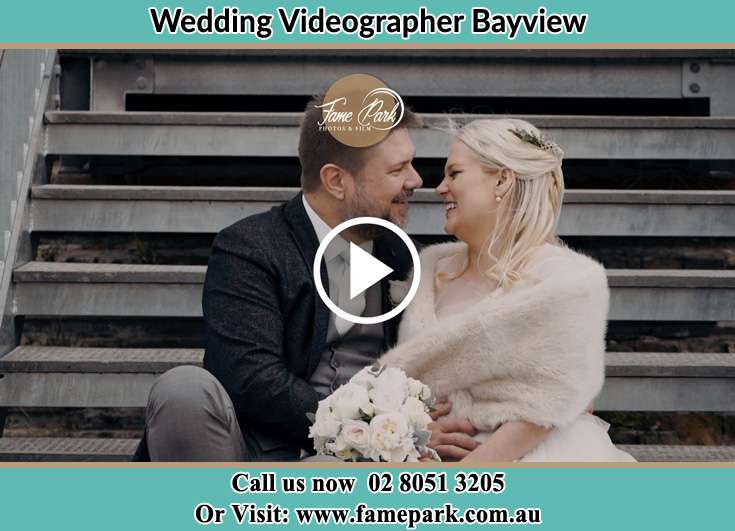 Bride and Groom looking at each other while sitting on the staircase Bayview NSW 2104