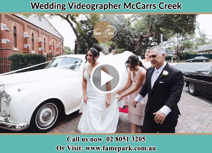 Bride and her father walking near the bridal car McCarrs Creek NSW 2105